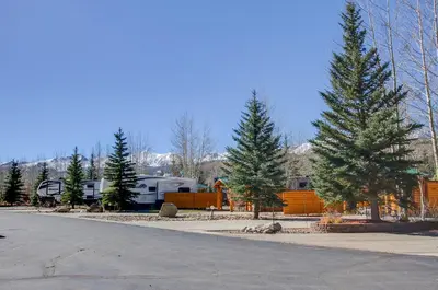 an rv park with pine trees and a road at #244 in Breckenridge