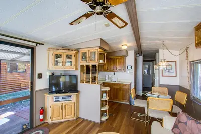 a kitchen with a refrigerator and a living room at #244 in Breckenridge
