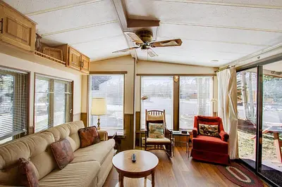 a living room with a couch and a ceiling fan at #244 in Breckenridge