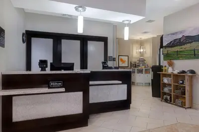 a lobby with a cash register in a store at Homewood Suites by Hilton Boulder in Boulder