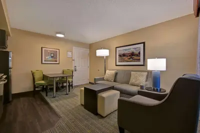 a living room with a couch and a table at Homewood Suites by Hilton Boulder in Boulder