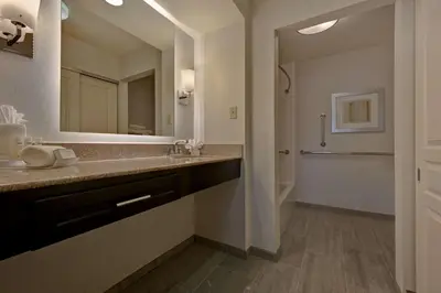 a bathroom with a sink and a mirror at Homewood Suites by Hilton Boulder in Boulder