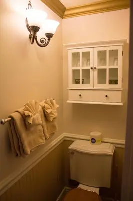 a bathroom with a white cabinet and a toilet at Frisco Lodge in Frisco