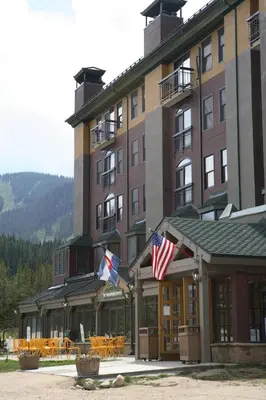 a building with two american flags in front of it at The Vintage Hotel in Winter Park
