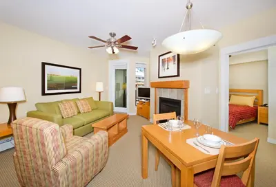 a living room with a couch and a table at Fraser Crossing and Founders Pointe in Winter Park