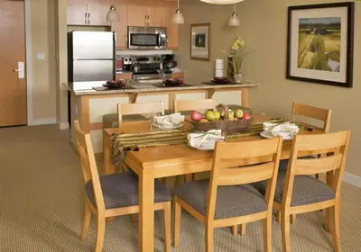 a kitchen and dining room with a table and chairs at Fraser Crossing and Founders Pointe in Winter Park