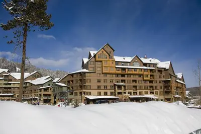 a large building with snow on the ground at Zephyr Mountain Lodge in Winter Park