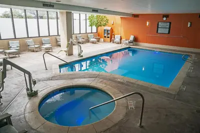 a large swimming pool in a hotel room at Embassy Suites by Hilton Denver Central Park in Denver