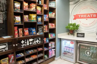 a food section of a store with snacks on shelves at Hampton Inn & Suites Denver-Speer Boulevard in Denver