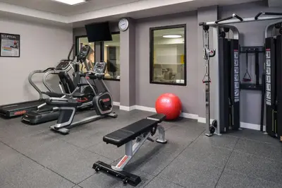 a gym with two tread machines and a red ball at Hampton Inn & Suites Denver-Speer Boulevard in Denver