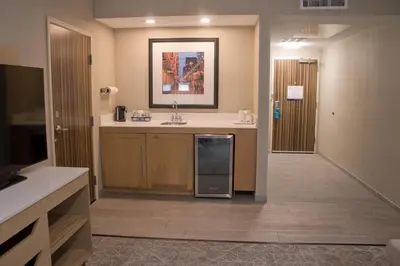 a kitchen with a sink and a counter top at Hampton Inn & Suites Denver-Speer Boulevard in Denver