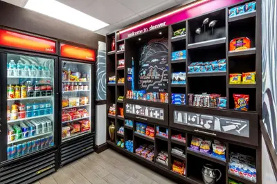 a grocery store aisle with drinks and snacks at Hampton Inn Denver-International Airport in Denver