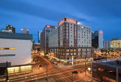 a city at night with a street with cars at Hilton Garden Inn Denver Downtown in Denver