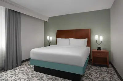 a bedroom with a large bed and a window at Hilton Garden Inn Denver Downtown in Denver