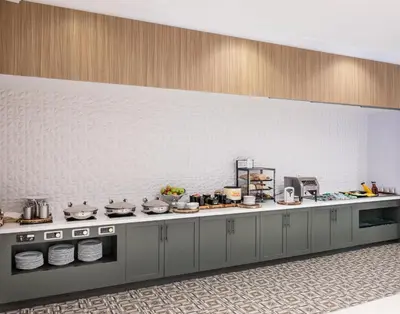 a kitchen with a counter with pots and pans at Hilton Garden Inn Denver Tech Center in Denver