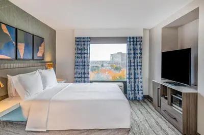 a hotel room with a bed and a television at Hilton Garden Inn Denver Tech Center in Denver