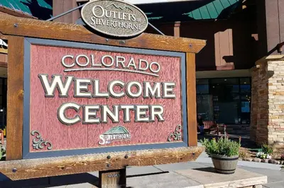 a sign for a welcome center in front of a store at Salt Lick #4812 - Wildernest in Silverthorne