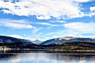 a view of a lake with mountains in the background at Salt Lick #4812 - Wildernest in Silverthorne