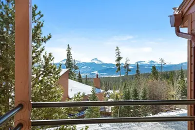 a view of the mountains from a window at Timber Ridge #410 - Wildernest in Silverthorne