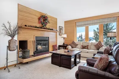 a living room with a couch and a fireplace at Timber Ridge #410 - Wildernest in Silverthorne