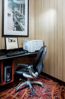 a black office chair sitting in front of a desk with a computer at Hampton Inn Denver - Northwest Westminster in Westminster