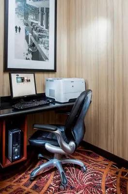 a black office chair sitting in front of a desk with a computer at Hampton Inn Denver - Northwest Westminster in Westminster
