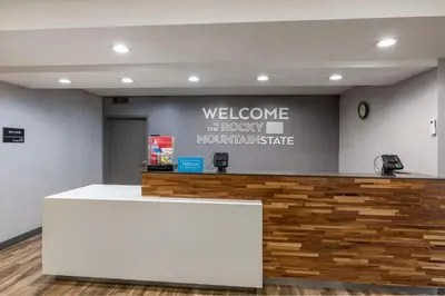 a welcome to theorymonturanceurance counter in a lobby at Hampton Inn Fort Collins in Fort Collins