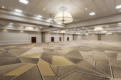 a large room with a hexagonal pattern on the floor at Hilton Fort Collins in Fort Collins