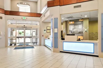 a lobby of a store with a large window at Holiday Inn Express & Suites Denver North - Thornton by IHG in Thornton