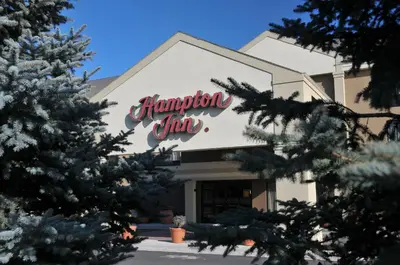 a hampton inn sign on the front of a building at Hampton Inn Boulder/Louisville in Louisville