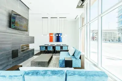 a living room with a couch and a table at Hilton Garden Inn Denver Union Station in Denver