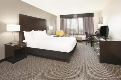 a hotel room with a bed and a desk at La Quinta by Wyndham Denver Englewood Tech Ctr in Greenwood Village