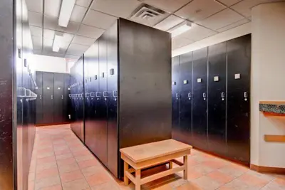 a row of lockers with a bench in a room at 1 Bedroom Colorado Vacation Rental In River Run Village Steps From The River Run Gondola in Keystone