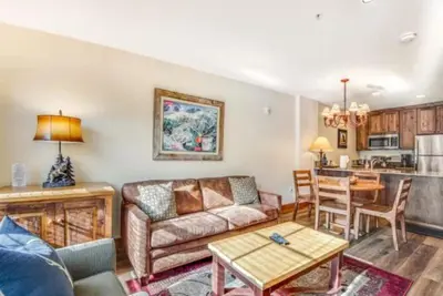 a living room with a couch and a table at 1 Bedroom Springs Condo In River Run Village Just 75 Yards From The River Run Gondola in Dillon