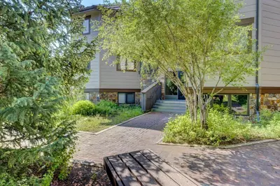 a park bench in front of a building at Frostfire E41 Condo in Keystone