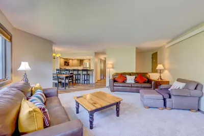 a living room with a couch and a table at Frostfire E41 Condo in Keystone