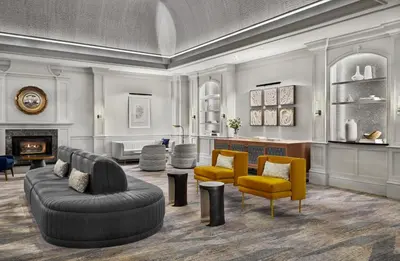 a living room with a couch and chairs and a fireplace at Kimpton Hotel Monaco Denver by IHG in Denver
