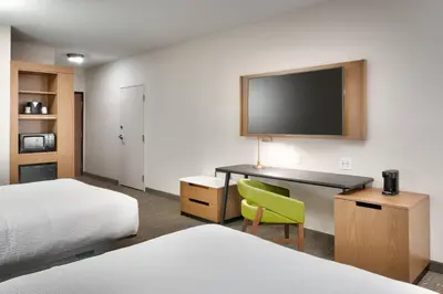 a hotel room with two beds and a desk with a television at Fairfield Inn & Suites by Marriott Denver West/Federal Center in Lakewood