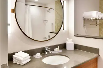 a bathroom with a sink and a mirror at Fairfield Inn & Suites by Marriott Denver West/Federal Center in Lakewood