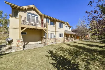 a large house with a yard in front of it at Larson Lane 217 Home in Frisco