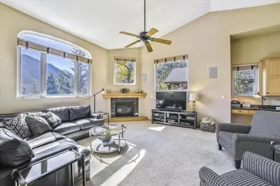 a living room with a couch and a fireplace at Larson Lane 217 Home in Frisco