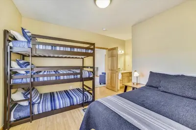 a bedroom with bunk beds and a bed at Larson Lane 217 Home in Frisco