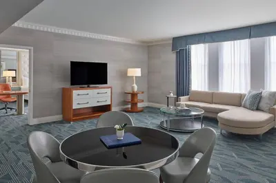a living room with a couch and a table at The Brown Palace Hotel and Spa, Autograph Collection in Denver