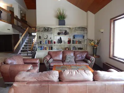 a living room with a couch and a book shelf at Iron Horse Building C Unit 1023 in Winter Park