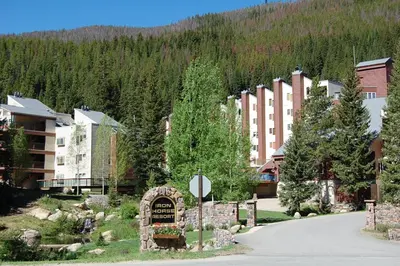 a resort with a sign in the middle of a road at Iron Horse Building C Unit 1023 in Winter Park