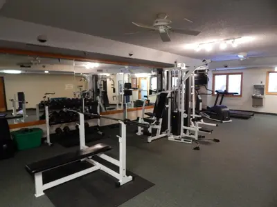 a gym with several tread machines and a ceiling at Iron Horse Building C Unit 1023 in Winter Park