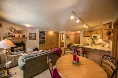 a living room with a couch and a table at Iron Horse Building D Unit 4104 in Winter Park