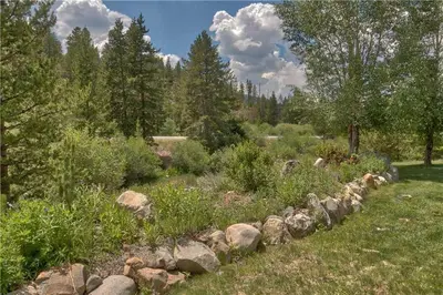 a garden with rocks and plants in a field at Villas at Swan's Nest #701 (Condo) in Gold Hill