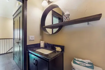 a bathroom with a sink and a mirror on the wall at Ogren Overlook in Keystone