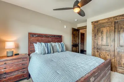 a bedroom with a bed and a ceiling fan at 2nd Ave Luxury in Frisco
